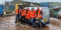 Waste firm workers clean up for charity with a car wash