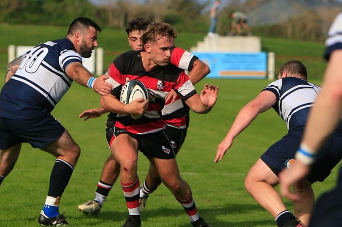 Cornish Pirates centre Harris Eddy prepares to try and hand off a St Ives defender. Picture: Brian Tempest