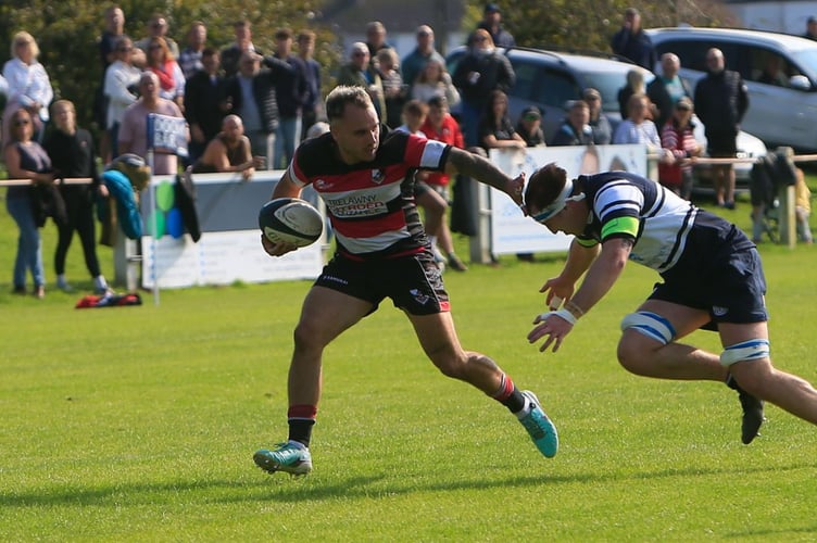 Morgan Holman aims to get clear of the covering St Ives defender. Picture: Brian Tempest