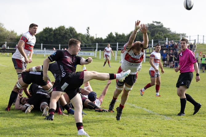 Camborne lock Dan Marais looks to block a clearing kick against Taunton. Picture: Steve Mock