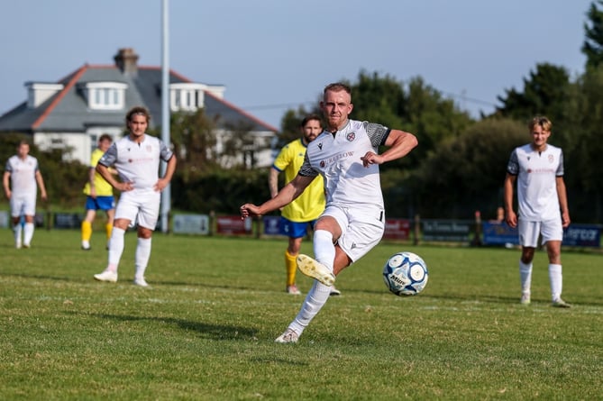 St Austell's Max Gilbert slots home a second half penalty against Bridgwater United. Picture: Paul Williams