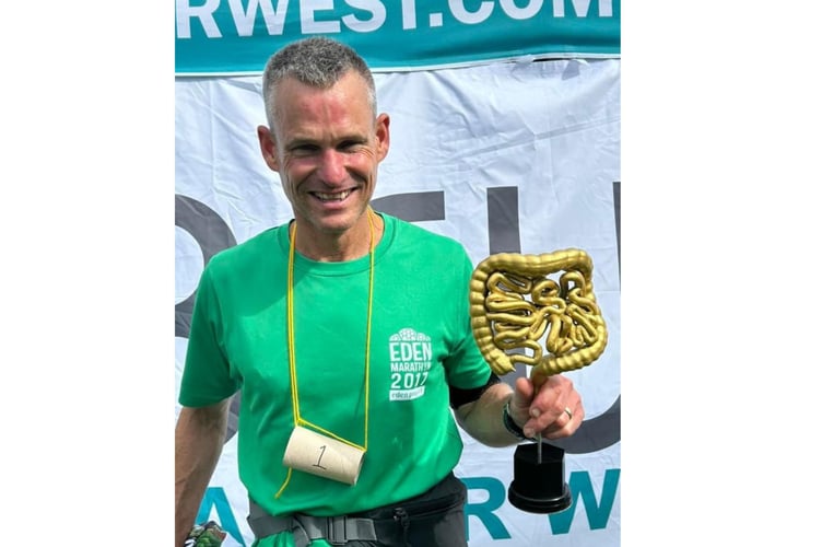 Winner Oli Jones was all smiles after completing 26 4.1-mile laps on the hour, every hour. Pictures: East Cornwall Harriers