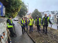 Bodmin BlueTiTs brave the rain to transform overgrown part of town 