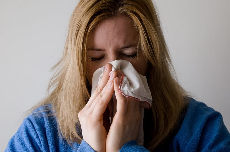 woman sneezing