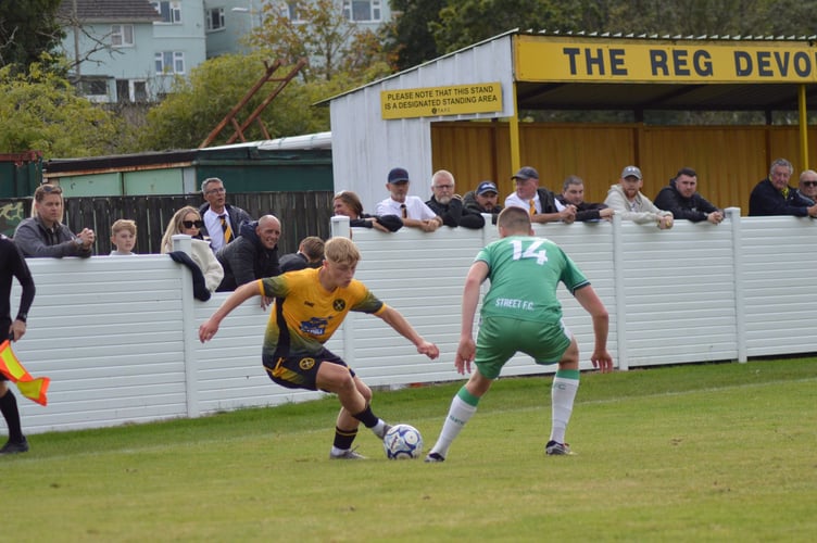 Torpoint Athletic winger Will Sullivan, who was also named man of the match, runs at the Street full-back. Picture: Matt Burgoyne