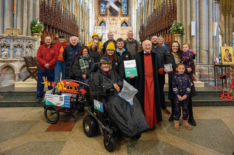 Steven Webb handing over a Cornwall 500 plaque at Truro Cathedral