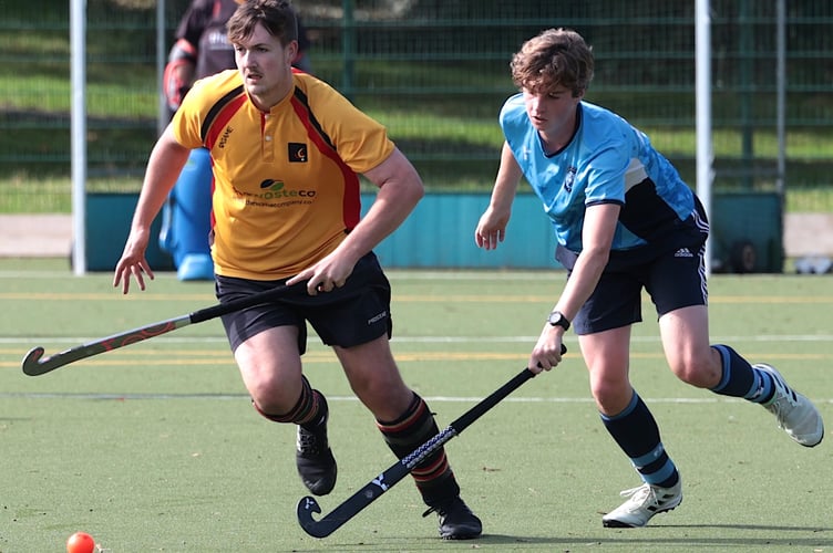 Caradon’s Liam Champion (left) looks to break clear of the Penzance defender. Glen Rogers