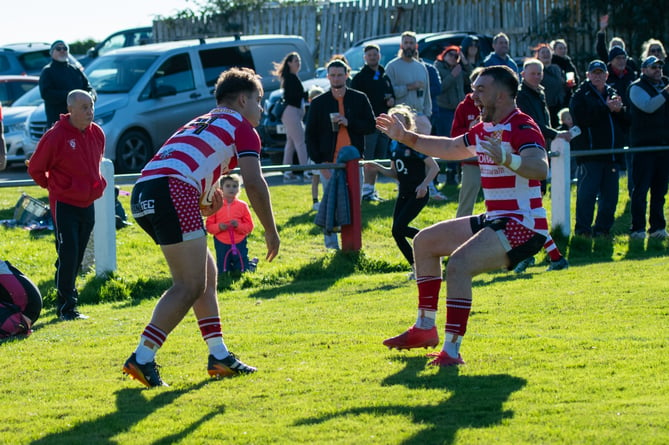 St Austell co-captain Ben Plummer congratulates winger Jamie Stanlake on his try. Picture: Dave Phillips