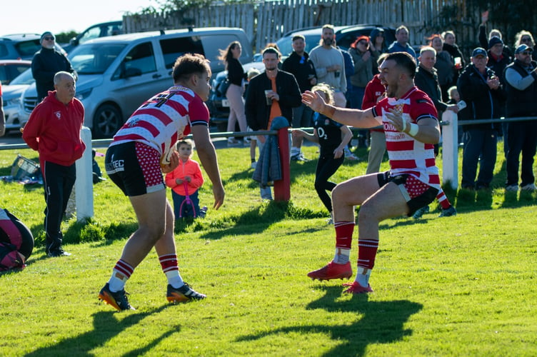 St Austell co-captain Ben Plummer congratulates winger Jamie Stanlake on his try. Picture: Dave Phillips