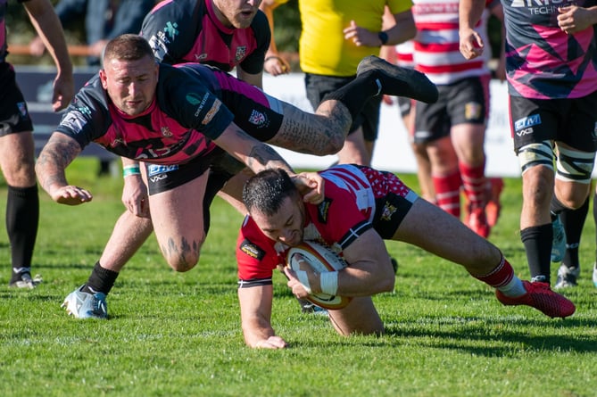 St Austell co-captain Ben Plummer dives over for the home side's fifth try of the afternoon. Picture: Dave Phillips