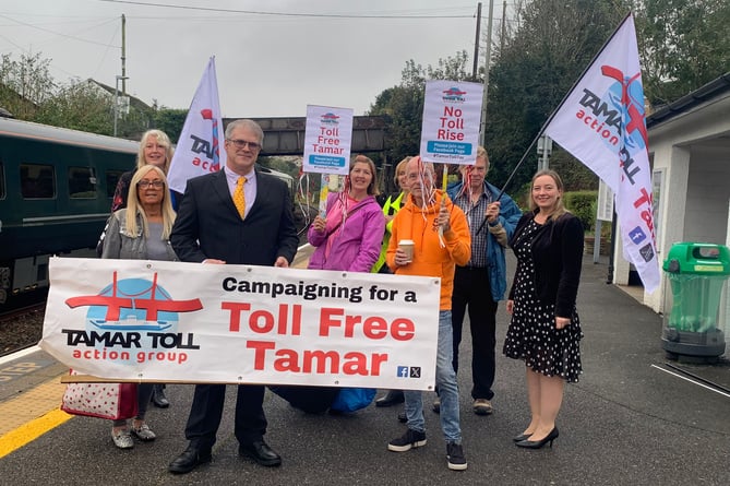 Members of the Tamar Toll Action Group prepare to catch the train to avoid the bridge toll ahead of their protest march today