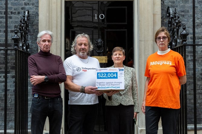 Robert Trewhella, 68, from Cornwall handing over the box of signatures to Downing Street