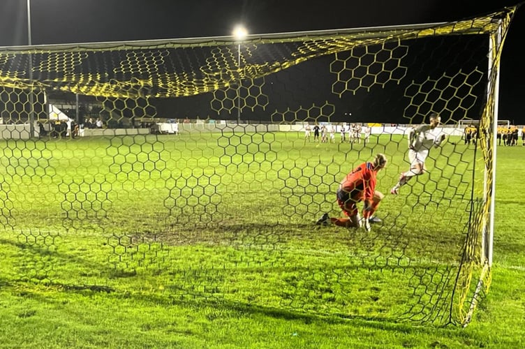 Tom Whipp runs off to celebrate after his penalty sealed St Austell's passage into the second round of the Les Phillips Cup. Picture: Kevin Marriott