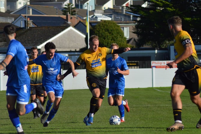 Torpoint Athletic's Elliott Crawford drives forward as his captain Luke Cloke looks on. Picture: Matt Burgoyne