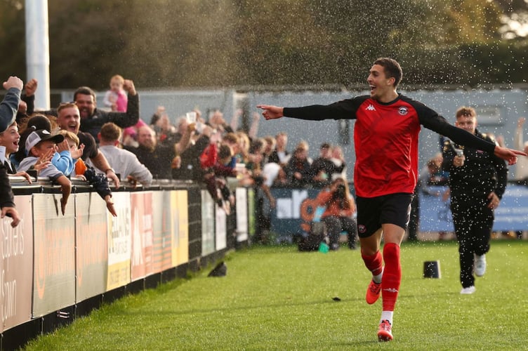 Jaze Kabia's all smiles as he celebrates his injury-time winner at the Truro City Stadium. Picture: Luke Williams/PPAUK