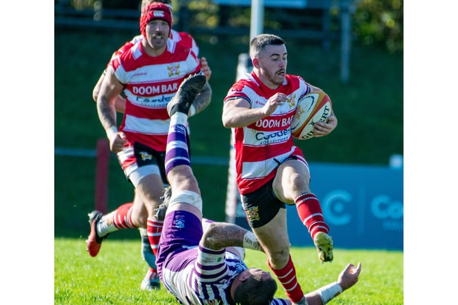 St Austell scrum-half Dan Tyrrell escapes a tackle. Picture: Dave Phillips