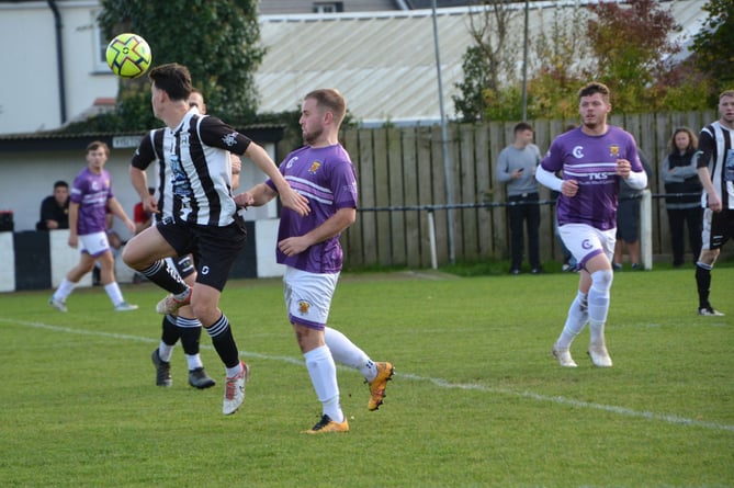 Holsworthy attacker Sam Jago looks to win the ball in the air. Picture: Rodney Parrish