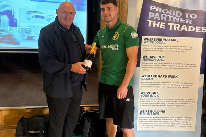 St Blazey left-back Ben Rowe receives his man of the match award from club legend Dave Pearce. Picture: St Blazey AFC