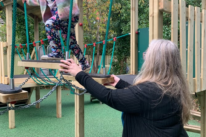 Having a go for the first time on the new play equipment