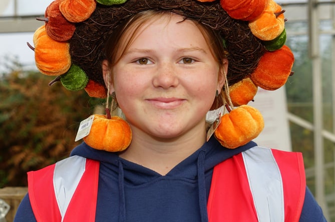 A smile from Ruby  of Crdar Croft Nurseries proudly wears her pumpkin crown                