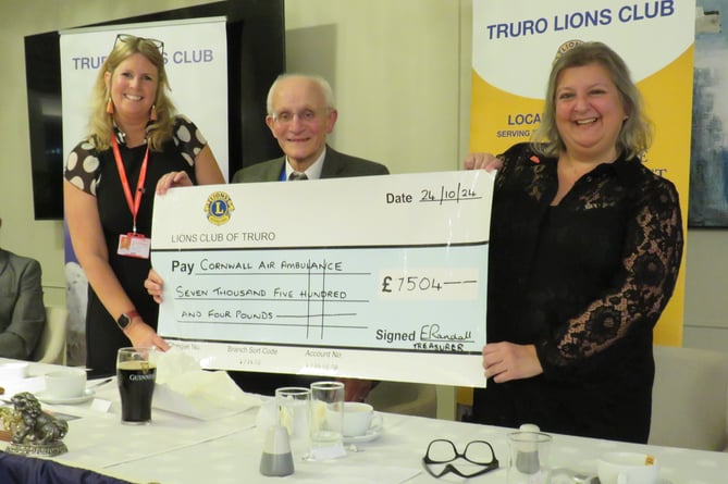 Truro Lions president Mike Kalis presents a cheque to Karen Hurn and Jen Morgan from Cornwall Air Ambulance Trust 