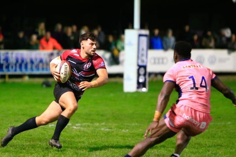 Pirates' replacement fly-half Iwan Jenkins is opposed by Exeter's hat-trick scoring wing Paul Brown-Bampoe. Picture: Brian Tempest