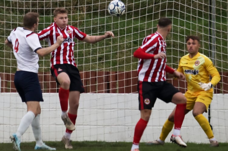 Saltash United clear their lines under pressure. Picture: Daz Hands Photography