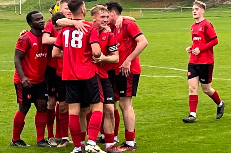 Dobwalls celebrate their match-clinching goal in their 4-2 success at St Day on Saturday which was scored by Dan Tate (18). Picture: Kevin Marriott