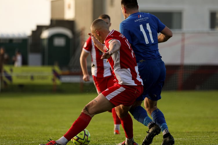 Newquay' joint player of the match Louis Price battles for possession with Penzance's Silas Sullivan. Picture: Ingrid Morrison