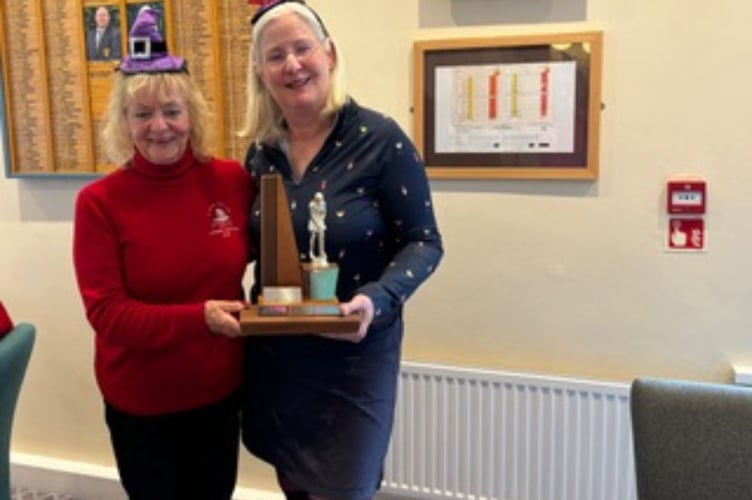 Lady secretary Sue Pascoe presents the trophy to lady captain Wendy Belcher. Picture: St Austell Golf Club