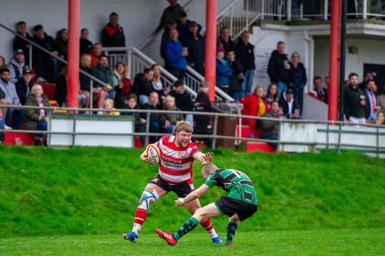 St Austell hooker Peter Harris sits down a defender on the right wing. Picture: Dave Phillips