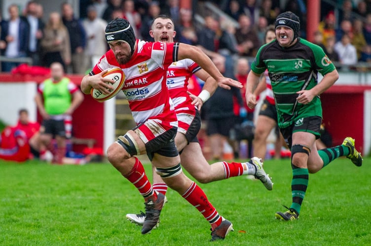 St Austell flanker Kaydan Michael runs away to score the Saints' eighth try. Picture: Dave Phillips