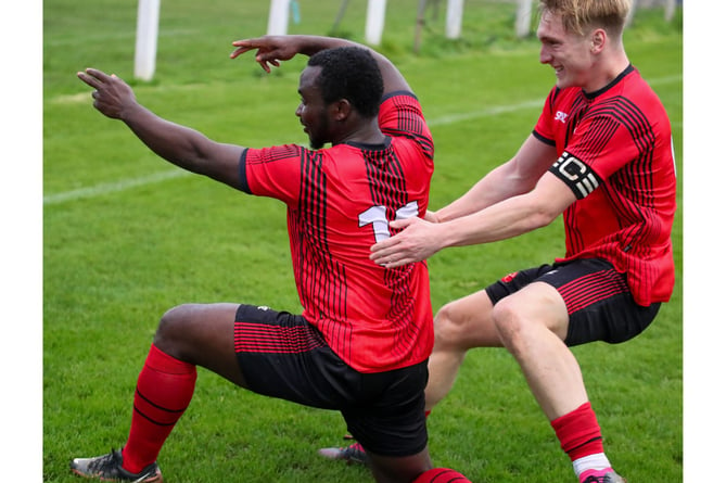 Dobwalls captain Charlie Castlehouse runs over to congratulate Kaycee Fidelis on his opening goal against Launceston on Saturday. Picture: Colin Hilton