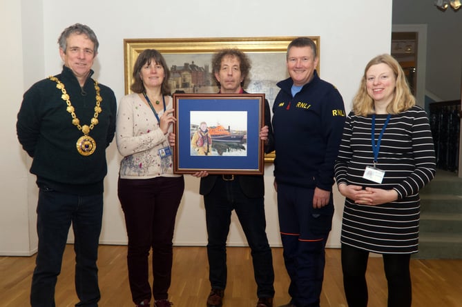 Nick Langdon prents drawing to Penlee House Museum and Gallery. L-r Mayor of Penzance Stephen Reynolds, Katie Herbert curator/deputy director Penlee House, Nick Langdon, Tony Rendle mechanic at Penlee Lifeboat Station and Anna Renton director Penlee House.