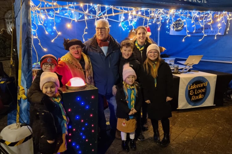 Liskeard Town Mayor Councillor Christina Whitty and Deputy Town Mayor, Cllr David Braithwaite, are joined by members of the 1st Liskeard Scout Group for the official lights switch on