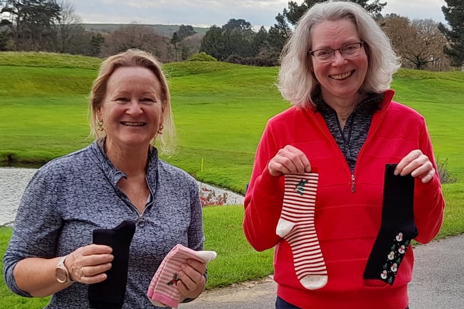 Julie Cleaton (left) and Helen Wormald with their socks. Picture: St Mellion Golf Club 