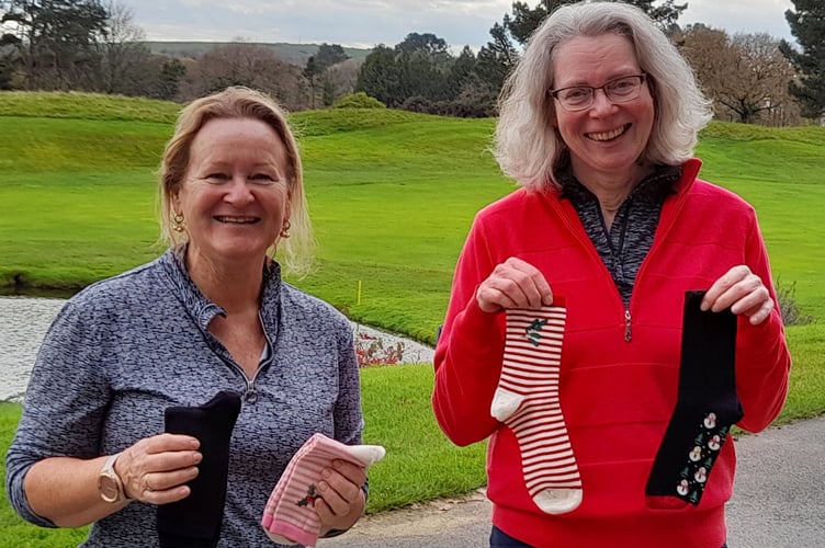 Julie Cleaton (left) and Helen Wormald with their socks. Picture: St Mellion Golf Club 