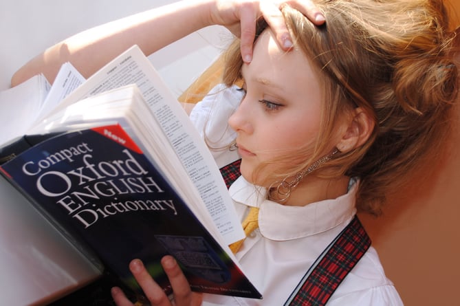 Girl reading OED