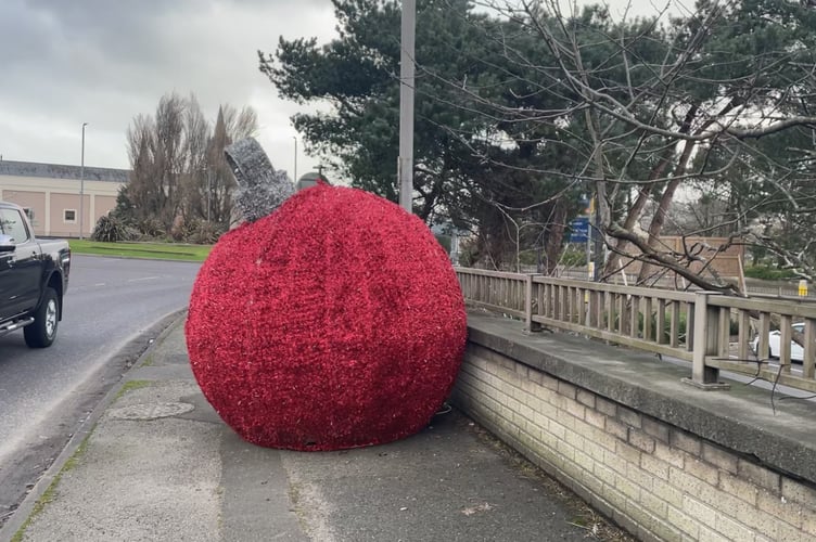 The liberated bauble tethered to a lamp post