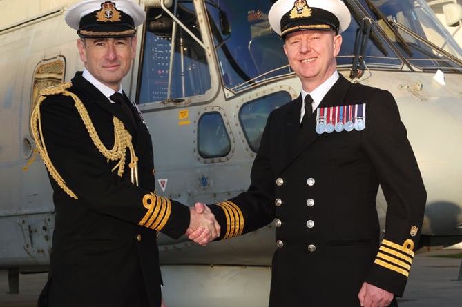 Pictured- Captain Stuart Irwin (left) handing over the command to Captain Hall.
RNAS Culdrose welcomed Captain James Hall as he becomes the new commanding officer of the Helston air station.
Captain Hall said: âI am incredibly proud and excited to return home to RNAS Culdrose. As a previous Sea King and Merlin aviator it is a huge privilege to take command of this air station at a time when we have already commenced the transition of maritime aviation to encompass uncrewed and autonomous systems within our fighting arm.
âThe women and men of the Fleet Air Arm are the heartbeat of everything that we do, and the team here at Culdrose is pivotal to delivering outputs for our nation. The continued necessity to protect the UKâs strategic nuclear deterrent, to defend the carriers HMS Prince of Wales and HMS Queen Elizabeth, whilst also deploying on other ships across the globe, will ensure that we remain at the forefront of developments in maritime warfare and naval aviation.â
