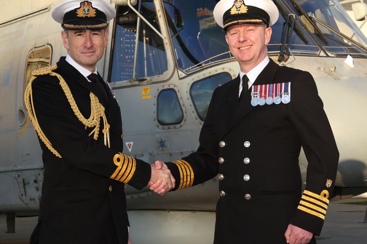 Pictured- Captain Stuart Irwin (left) handing over the command to Captain Hall.
RNAS Culdrose welcomed Captain James Hall as he becomes the new commanding officer of the Helston air station.
Captain Hall said: âI am incredibly proud and excited to return home to RNAS Culdrose. As a previous Sea King and Merlin aviator it is a huge privilege to take command of this air station at a time when we have already commenced the transition of maritime aviation to encompass uncrewed and autonomous systems within our fighting arm.
âThe women and men of the Fleet Air Arm are the heartbeat of everything that we do, and the team here at Culdrose is pivotal to delivering outputs for our nation. The continued necessity to protect the UKâs strategic nuclear deterrent, to defend the carriers HMS Prince of Wales and HMS Queen Elizabeth, whilst also deploying on other ships across the globe, will ensure that we remain at the forefront of developments in maritime warfare and naval aviation.â
