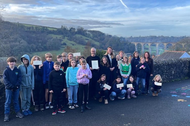 Calstock CP School received a visit from South East Cornwall MP Anna Gelderd who gave certificates and a prize for the winning Christmas card design created by Year 6 pupil Angelina. (Picture: MP Anna Gelderd)