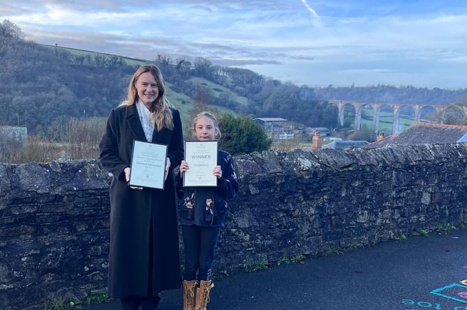 MP Anna Gelderd with the winner of her Christmas card competition Angelina 