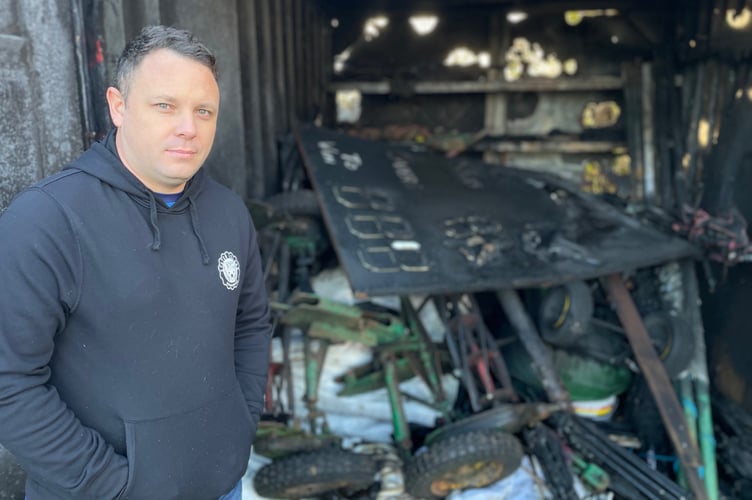 Saltash Cricket Club chairman Shayn Rencher surveys the damage caused following an arson attack at the club's ground on Thursday