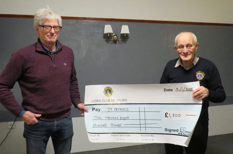 Truro Lion President Mike Kalis presents a cheque to St Petrocs’ Hugh Murrell                               