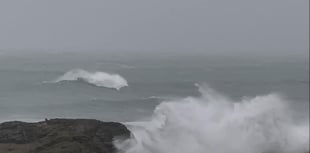 Two people risked life and limb wave watching during huge swell