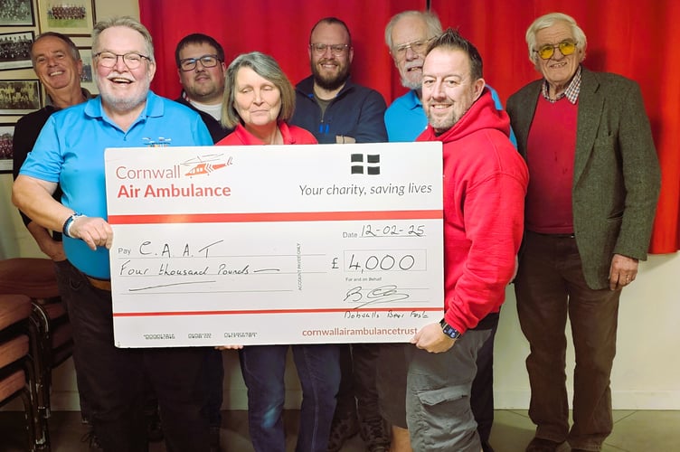 Representatives from the Cornwall Air Ambulance Trust are presented with a cheque for £4,000, which was raised at the Dobwalls Beer Festival