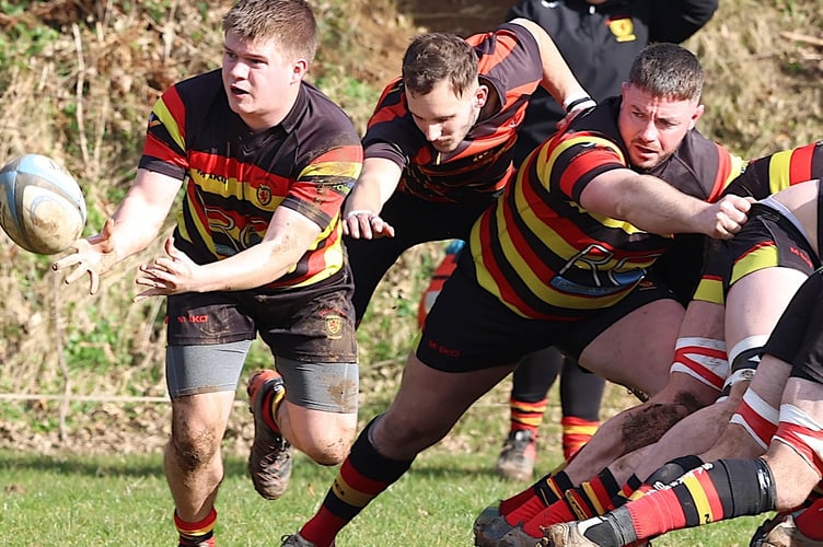 Saltash Scrum Half Jack Pritchard Lions Scrum Half Jay Mason trying to tackle.