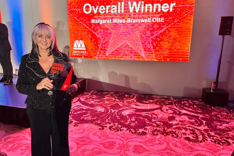 Margaret Miles-Bramwell receiving an award at the National Business Woman of the Year 2023