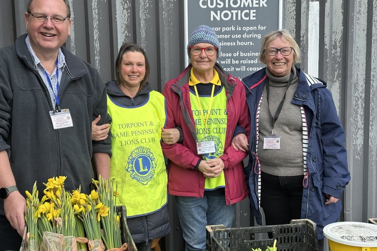 Volunteers from the Torpoint & Rame Peninsula Lions club selling daffodils at Kernow Mill